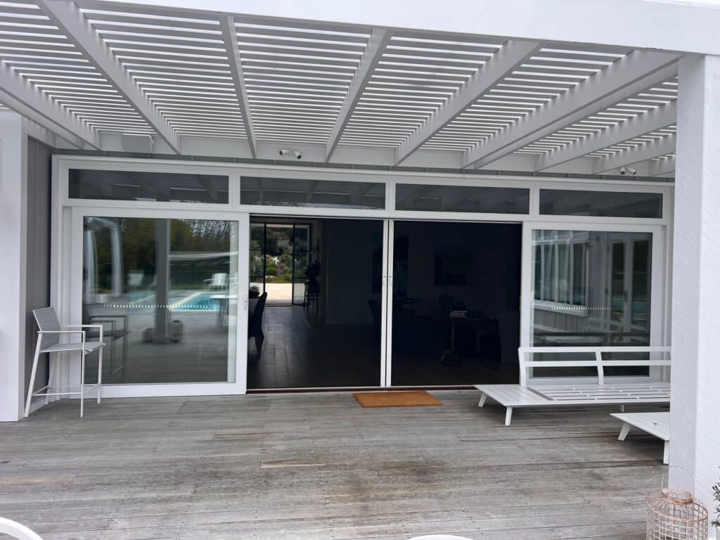 RetractAscreen Premium Dual Screens on Dual Sliding Doors outside view (Rolled Across)