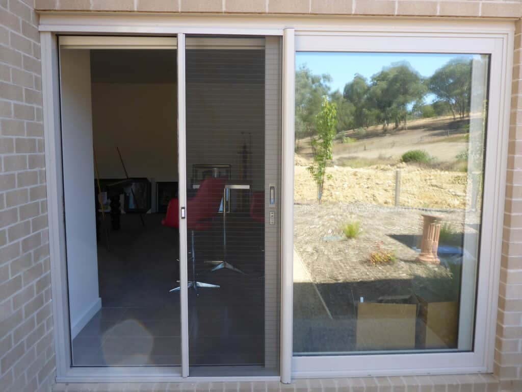 RetractAscreen Slimline on Sliding Door Invisi-Stripe (Partway)