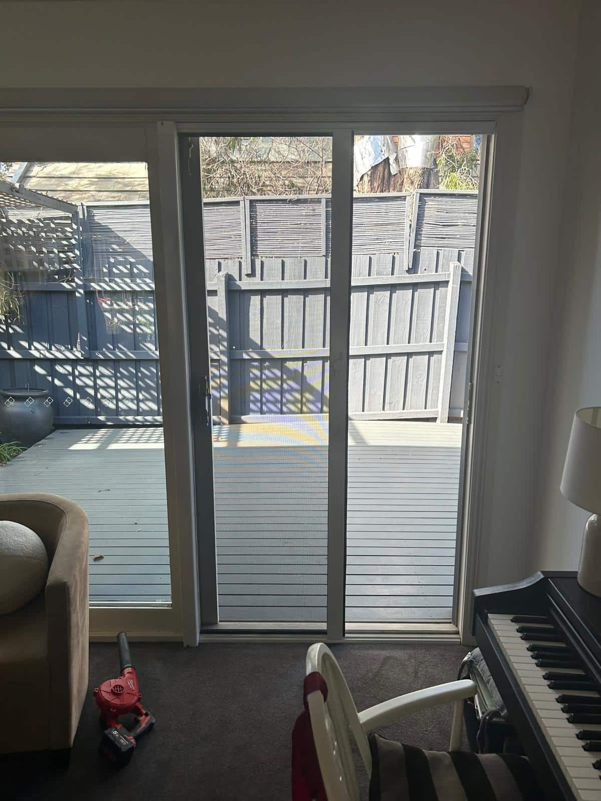 RetractAscreen Premium on Sliding Door (Partway) - Black Rock Project